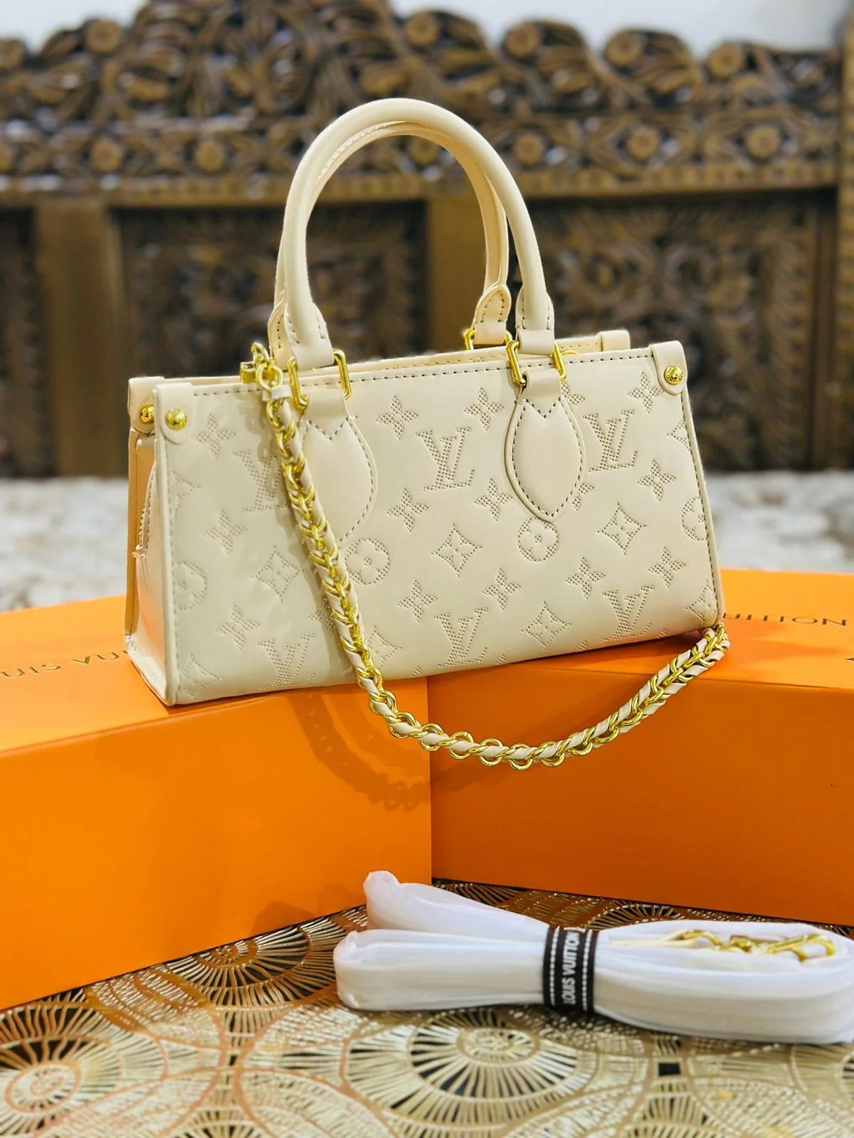 OnTheGo East West Monogram Empreinte Leather Bag